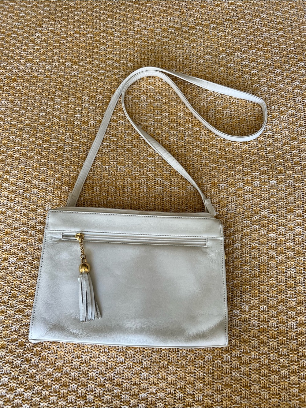 Vintage White Leather Crossbody Bag with Tassel Accent